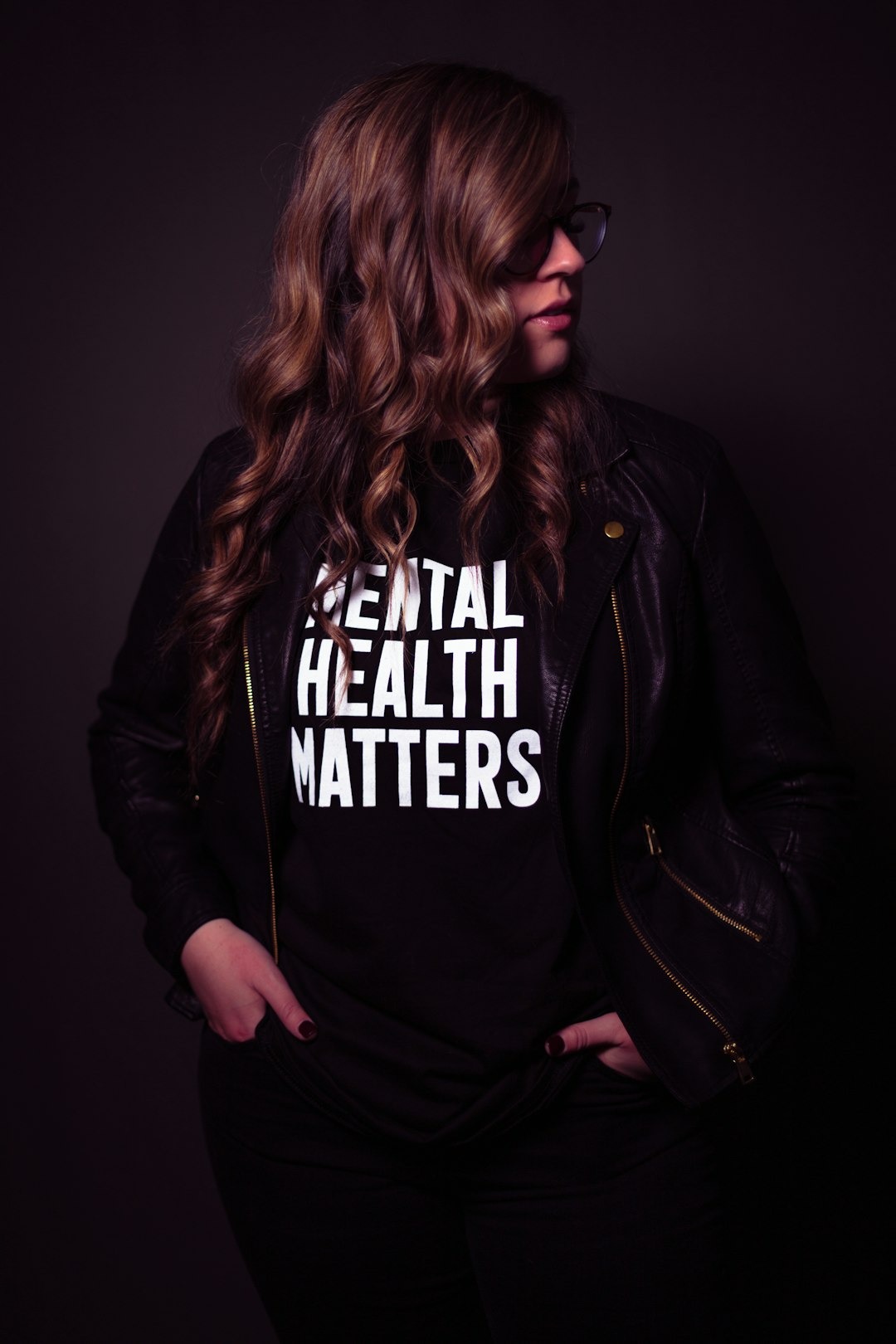 Person wearing a black t-shirt that says Mental Health Matters.